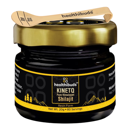 A jar of healthbuds Kinetq Pure Himalayan Shelajit resin form, featuring a black jar with a gold lid and a black and yellow label, complete with a wooden spoon resting on top.