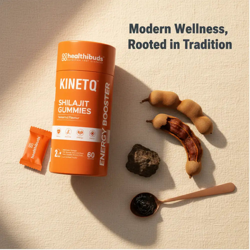 Kinetiq Shilajit Gummies packaging with tamarind pods and a spoon on a beige background.